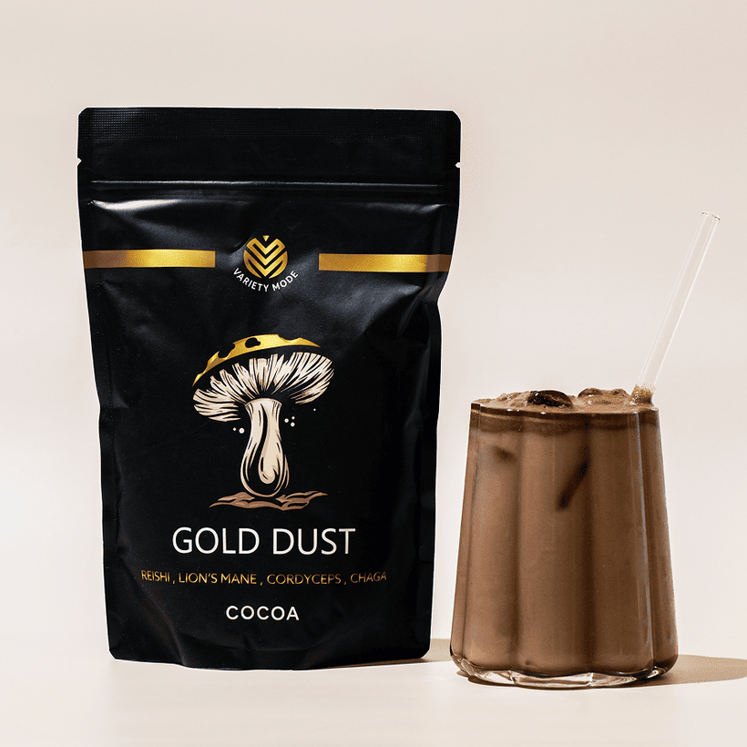 Gold Dust cocoa pouch beside a glass of chocolate drink.
